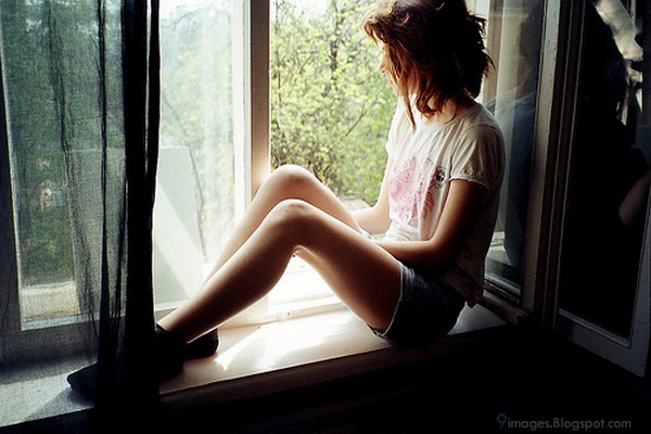 Alone-cute-girl-waiting-someone-on-window-sadness