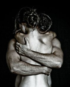man holding woman arms
